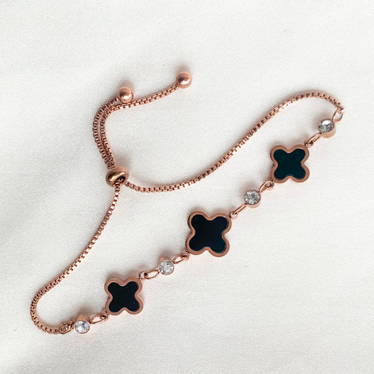 Adjustable rose gold bracelet with lucky black clover motifs and crystal detailing – perfect for gifting or daily wear