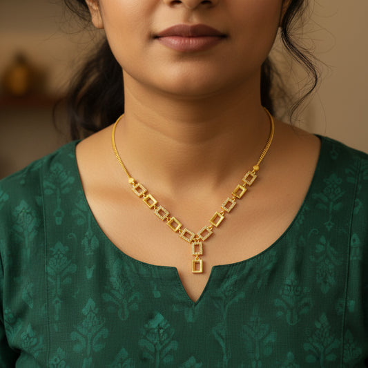 Gold-plated necklace featuring a sleek geometric design and sparkling American Diamond stones – perfect for party and festive wear