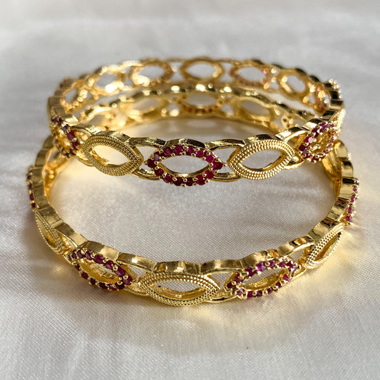 Lightweight gold-toned bangles featuring delicate pink crystals – perfect for festivals and ethnic wear