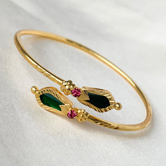 Traditional gold-plated green Palakka Nagapadam design open bangle with ruby stones – ethnic South Indian jewelry for weddings and festivals