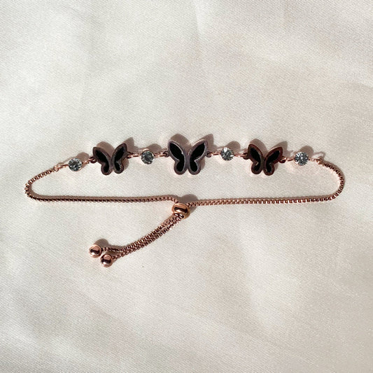 Rose gold adjustable butterfly bracelet with black enamel and crystal accents – elegant feminine jewelry for daily and party wear