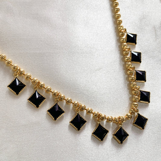 Stylish gold-plated necklace featuring black square beads – modern accessory for girls’ casual or festive wear