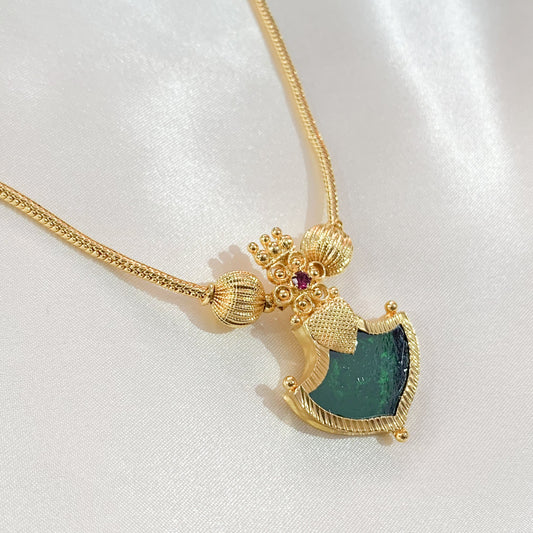 Traditional gold-plated necklace with green Palakka shield pendant – ethnic South Indian jewelry for festive and bridal wear