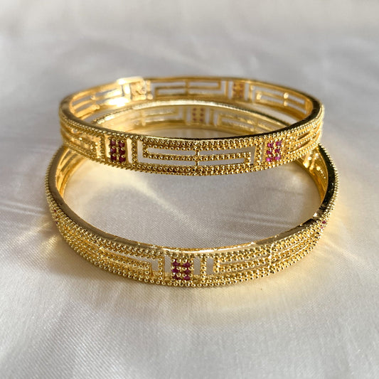 Traditional imitation gold bangles with fine ruby detailing – classic Indian jewelry for special occasions