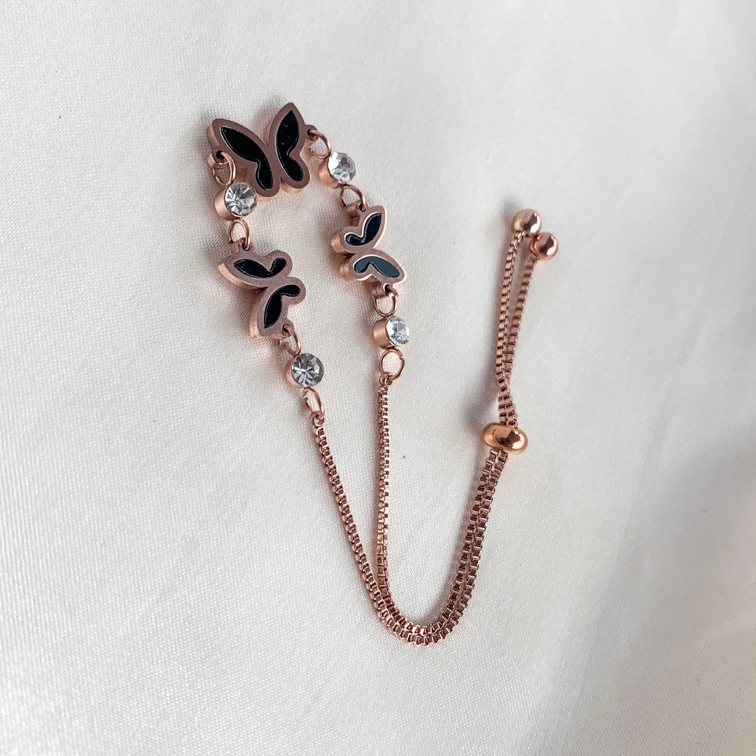 Chic butterfly bracelet in rose gold with black enamel and sparkling crystals – stylish accessory for women
