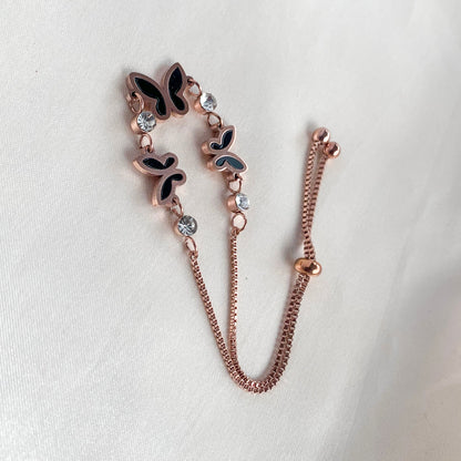 Chic butterfly bracelet in rose gold with black enamel and sparkling crystals – stylish accessory for women