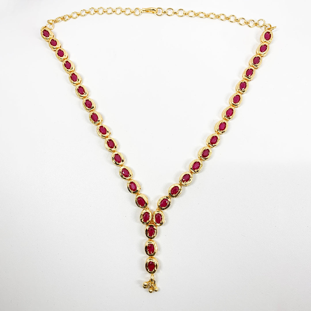 Classic gold-plated necklace featuring ruby-toned American Diamonds – graceful and timeless accessory for special events