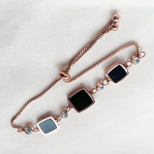 Elegant rose gold bracelet featuring black square enamel charms and sparkling crystal detailing – perfect for casual and party wear