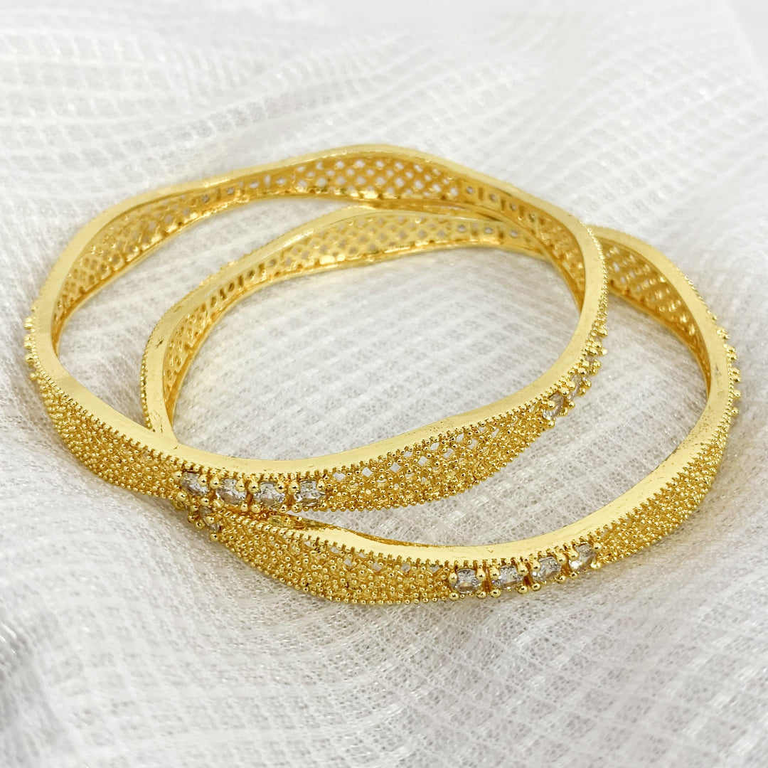 Gold-plated bangles with white stone embellishments – elegant designer jewelry for women