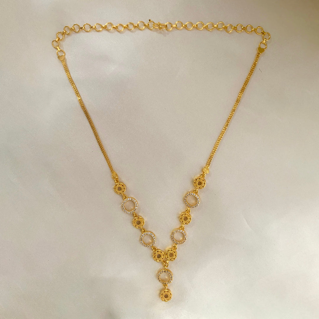 Gold-plated circle drop necklace with floral accents and CZ stones – elegant jewelry for women’s festive and daily wear