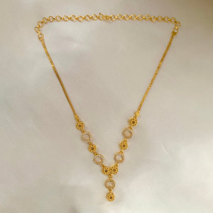 Gold-plated circle drop necklace with floral accents and CZ stones – elegant jewelry for women’s festive and daily wear