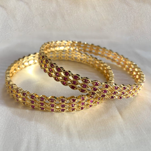 Gold lattice bangles with pink stone accents – traditional ethnic jewelry with elegant craftsmanship