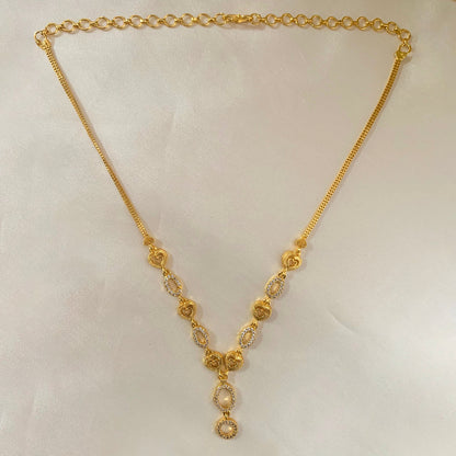 Minimalist gold-plated necklace adorned with AD stones – perfect for layering or wearing solo on special occasions