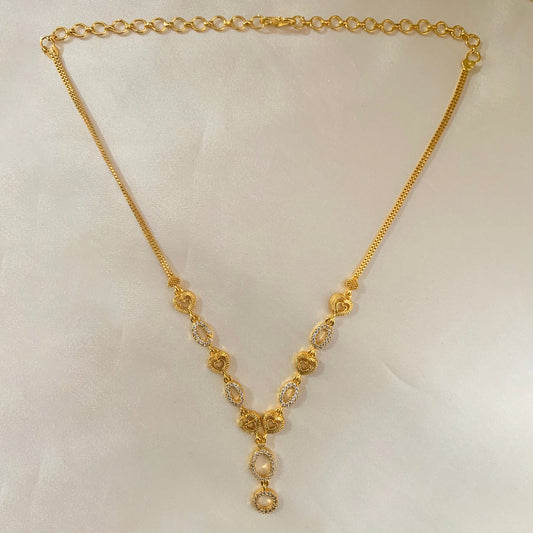 Minimalist gold-plated necklace adorned with AD stones – perfect for layering or wearing solo on special occasions