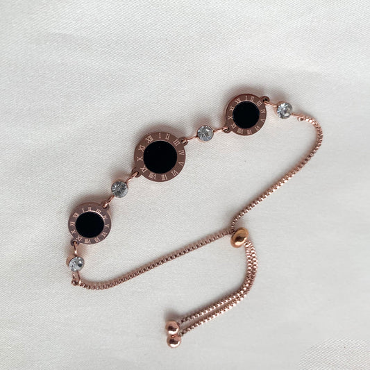 Modern Roman numeral bracelet in rose gold with black inlay and sparkling crystal detailing – chic accessory for women’s fashion