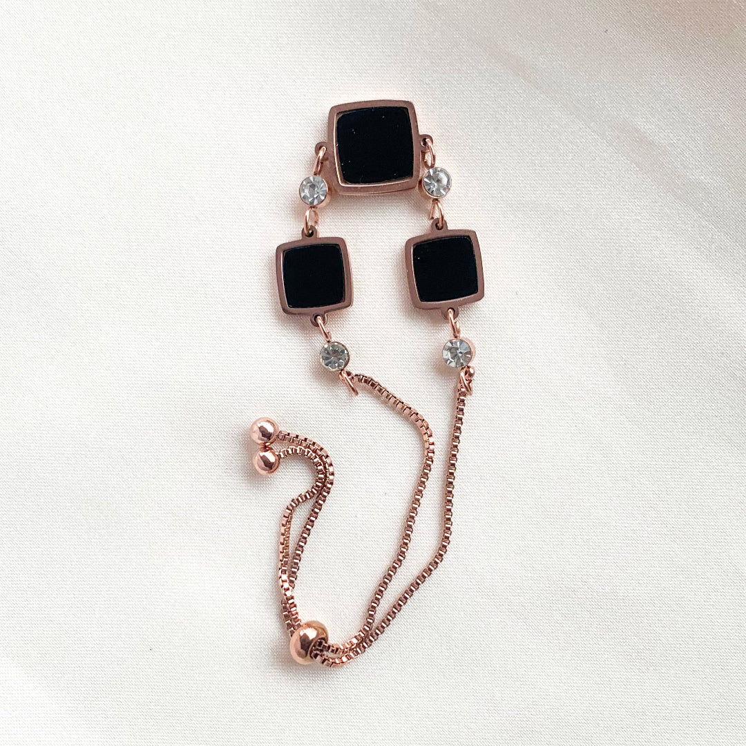 Rose gold adjustable bracelet with black square charms and crystal accents – modern minimalist jewelry for women