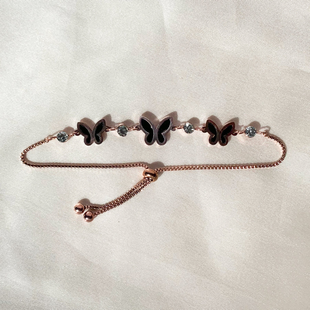 Rose gold adjustable butterfly bracelet with black enamel and crystal accents – elegant feminine jewelry for daily and party wear