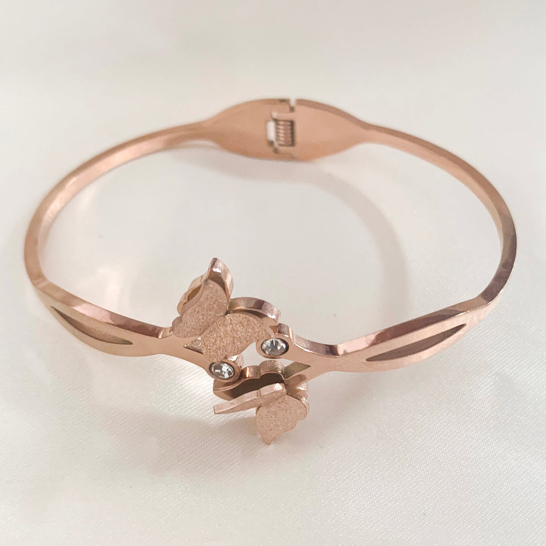 Rose gold butterfly design bangle bracelet with stone accents – elegant and feminine jewelry for women