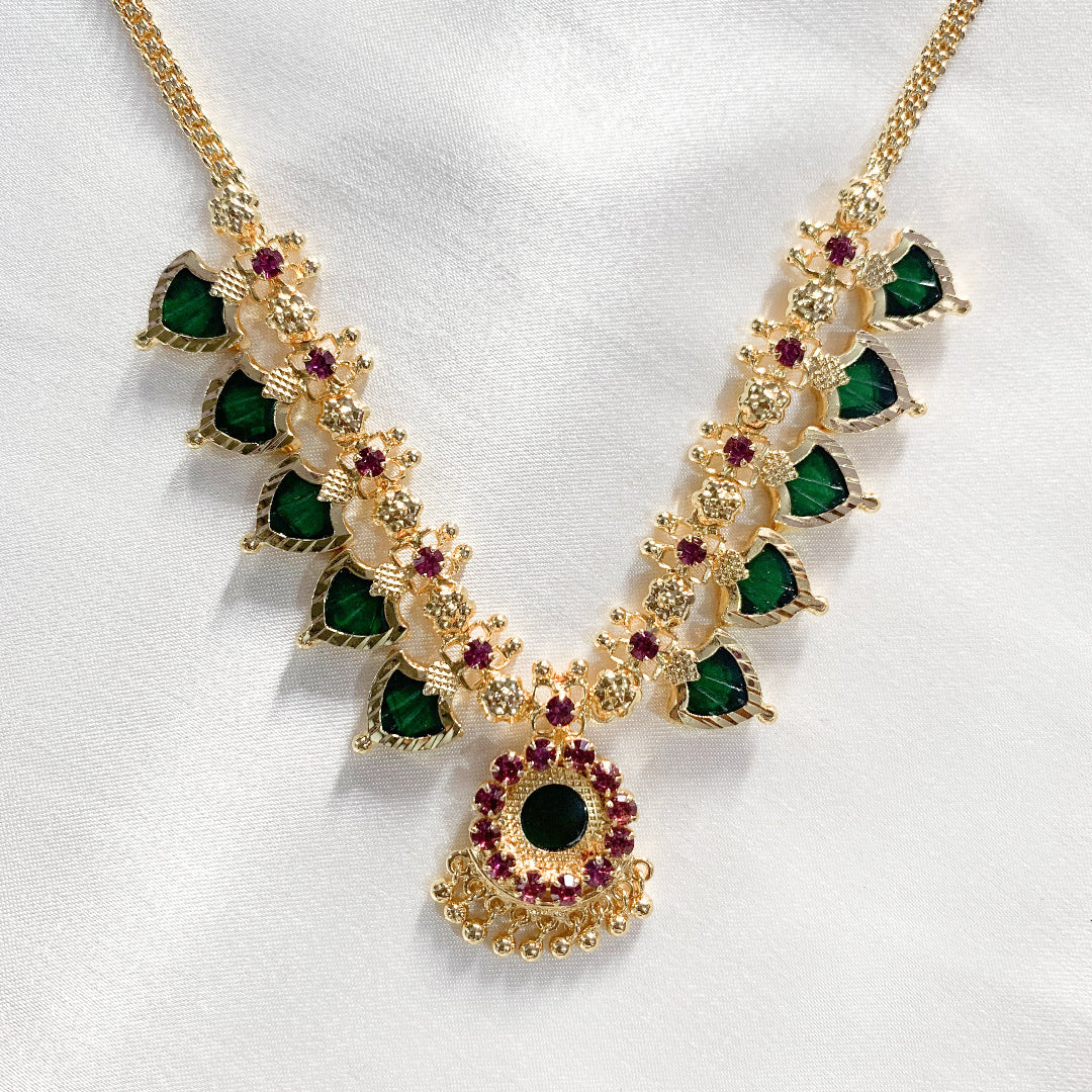 Traditional Palakka gold-plated necklace with green and pink stones – classic South Indian jewelry for festive and bridal wear
