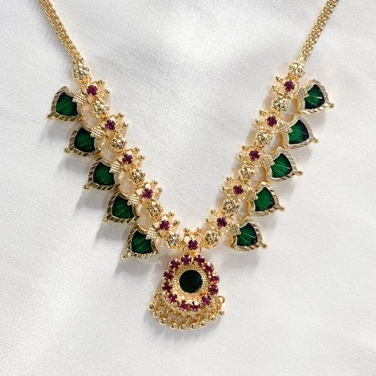 Traditional Palakka gold-plated necklace with green and pink stones – classic South Indian jewelry for festive and bridal wear