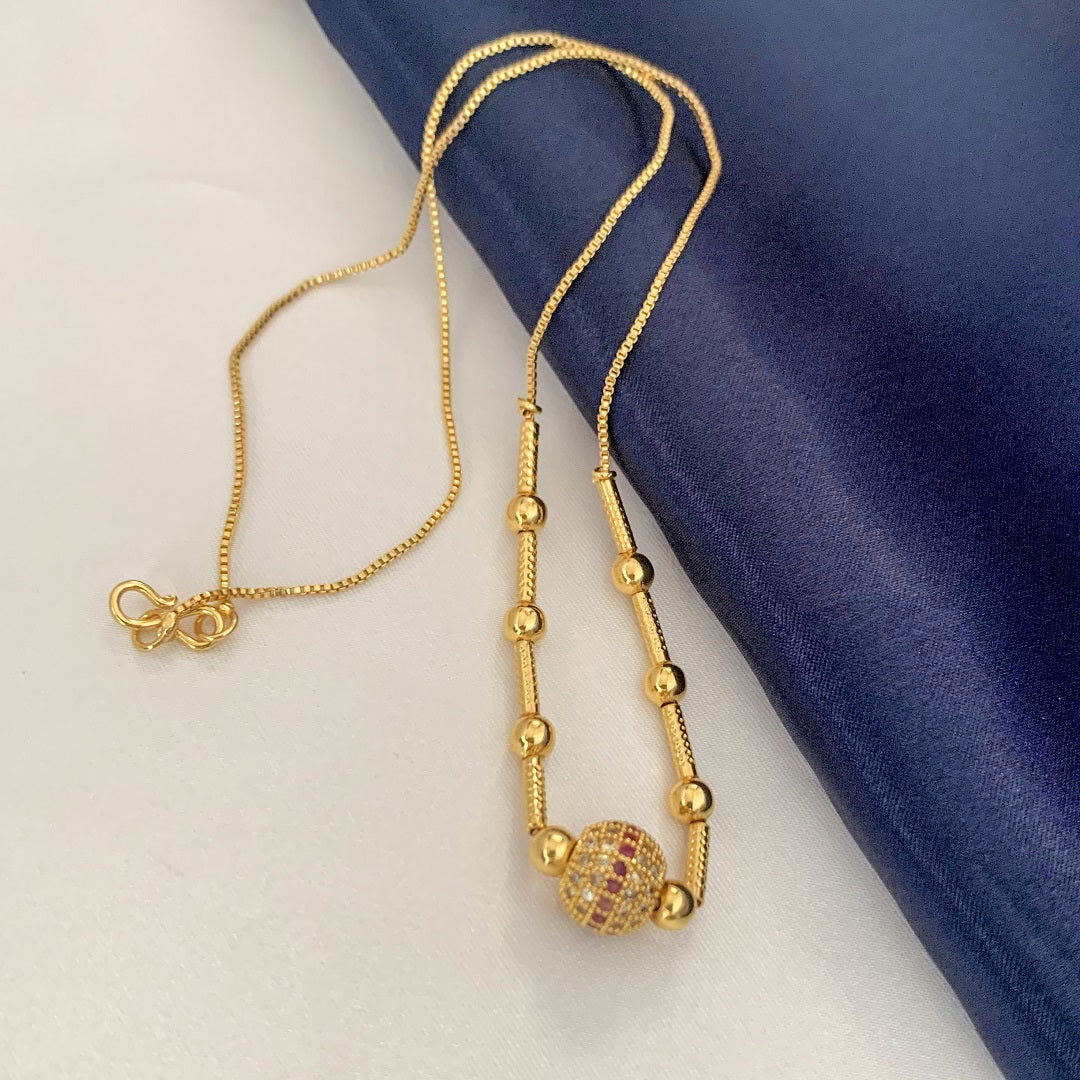 Elegant Gold Plated Beaded Chain Necklace with Red AD Stone Embellished Ball Pendant