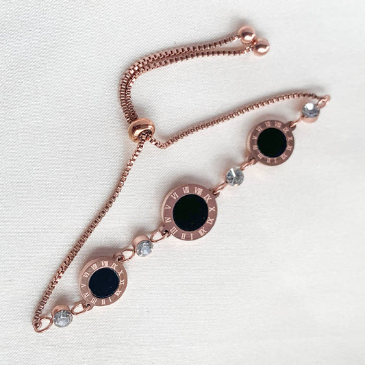 Elegant rose gold Roman numeral bracelet with black inlay and crystal detailing – modern minimalist jewelry for women